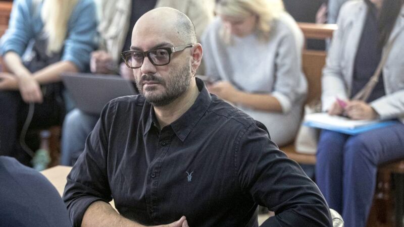 Russian theatre and film director Kirill Serebrennikov waits for hearings in a court in Moscow yesterday PICTURE: Pavel Golovkin/AP 