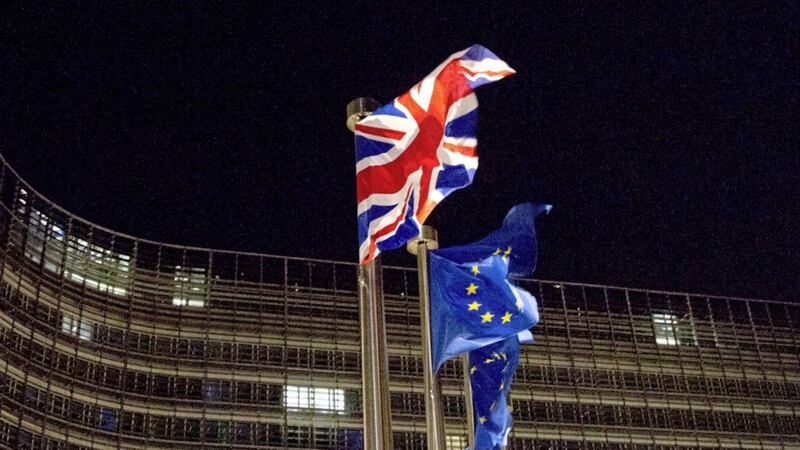 The British and European Union flags yesterday outside EU headquarters in Brussels 