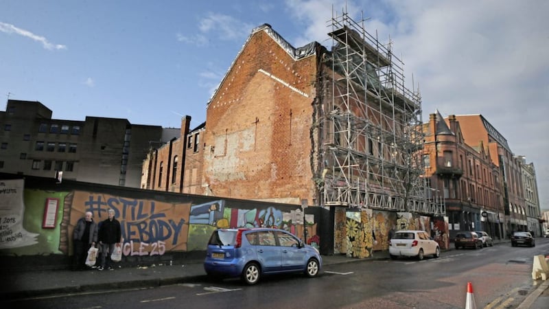 Scaffolding was erected four years ago to stop the collapse of the old Garfield Building on Belfast&#39;s North Street. Picture by Hugh Russell. 