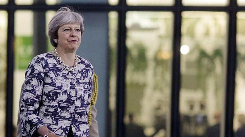 British Prime Minister Theresa May walks through the NATO headquarters prior to working session of a NATO a summit of heads of state and government in Brussels <br />&nbsp;
