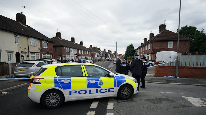 A police cordon at the scene in Knotty Ash, Liverpool, where a nine-year-old girl has been fatally shot. Picture by Peter Byrne, PA