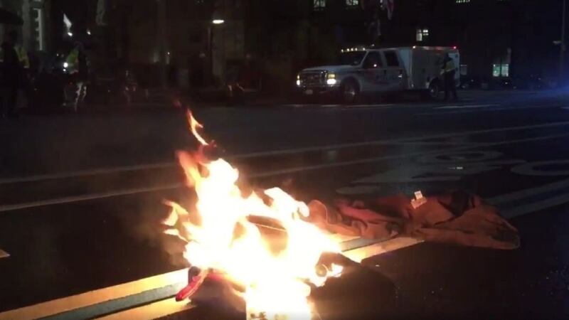 A demonstrator tried to set himself on fire outside Trump's Washington hotel