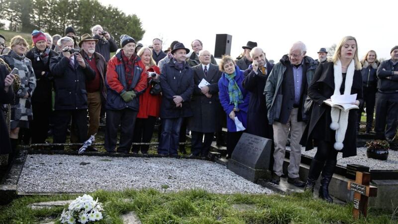 People gather at the graveside of Irish poet Patrick Kavanagh in Inniskeen, as they mark the 50th anniversary of his death. Picture by Brian Lawless/PA  