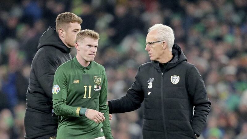Republic of Ireland&#39;s James McClean (centre) and manager Mick McCarthy appear dejected after the final whistle during the UEFA Euro 2020 Qualifying match against Denmark 