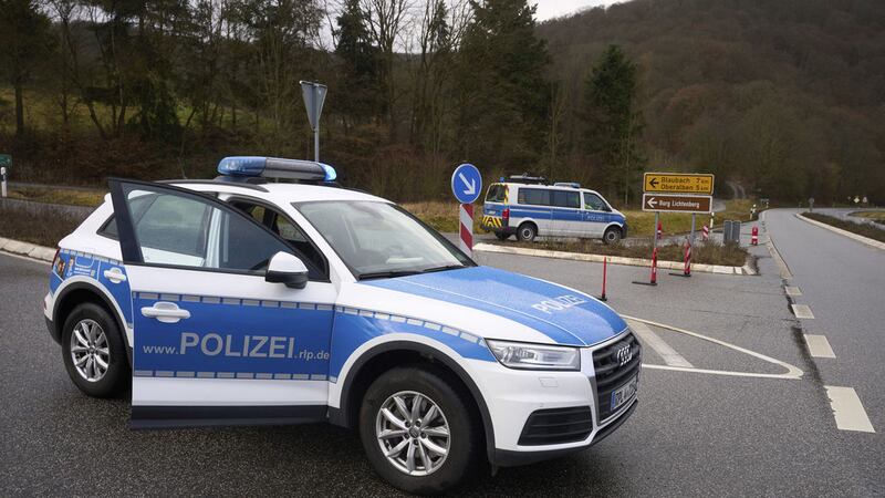 &nbsp;Police officers block the access road to the scene where two police officers were shot during a traffic stop near Kusel, Germany, Monday, January 31, 2022 (Thomas Frey/dpa via AP)