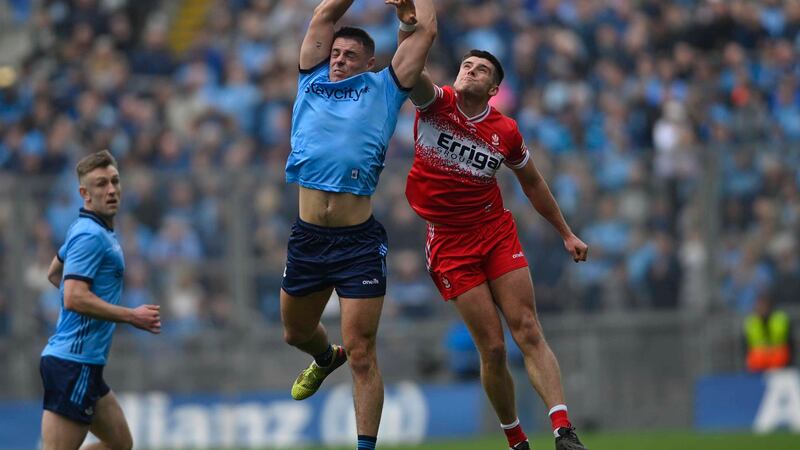 Dublin’s Brian Howard and Derry’s Conor Doherty contest a high ball.
