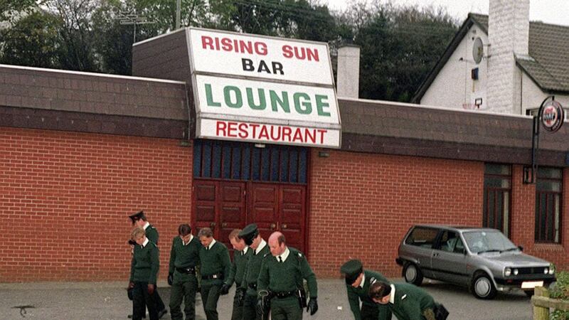 Police at the Rising Sun bar in Greysteel, Co Derry on the morning after eight people were shot dead in 1993. Picture by Pacemaker 