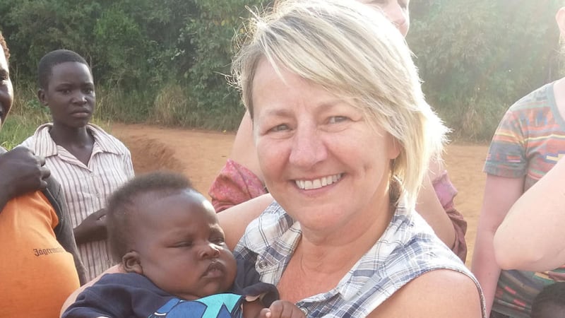 Paula McCann with one of the &#39;lucky&#39; children from New Beginnings children&#39;s village in Uganda 