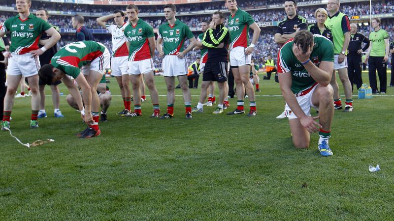Aidan O&rsquo;Shea and Mayo players and backroom members disconsolate after their 2013 All-Ireland SFC final defeat to Dublin <br />Picture by Colm O&rsquo;Reilly&nbsp;