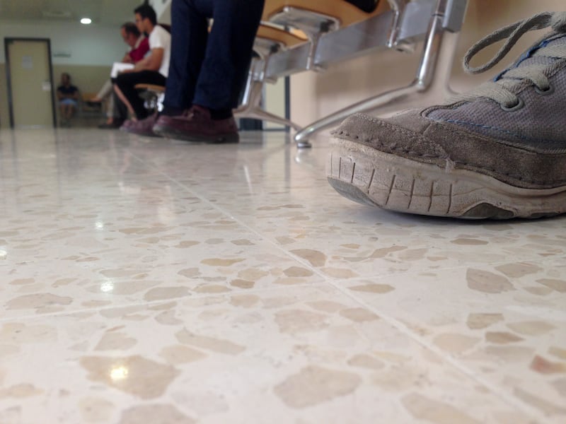 Feet shown in a hospital waiting room