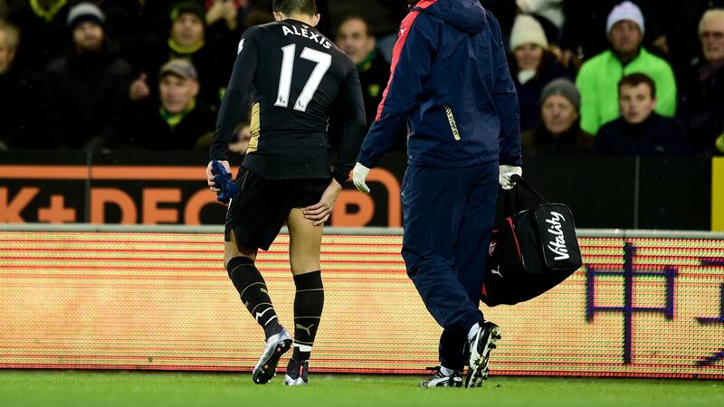 Arsenal's Alexis Sanchez hobbles off during last Sunday's Barclays Premier League match against Norwich at Carrow Road<br />Picture by PA&nbsp;