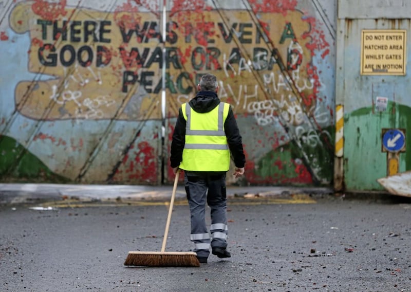 &nbsp;The clean up begins at the peace gates in Lanark Way in west Belfast after a night of rioting. Picture by Mal McCann