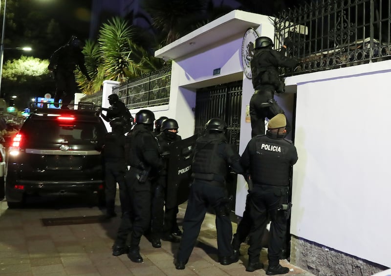Police make their way into the Mexican embassy in Quito, Ecuador (David Bustillos/AP)