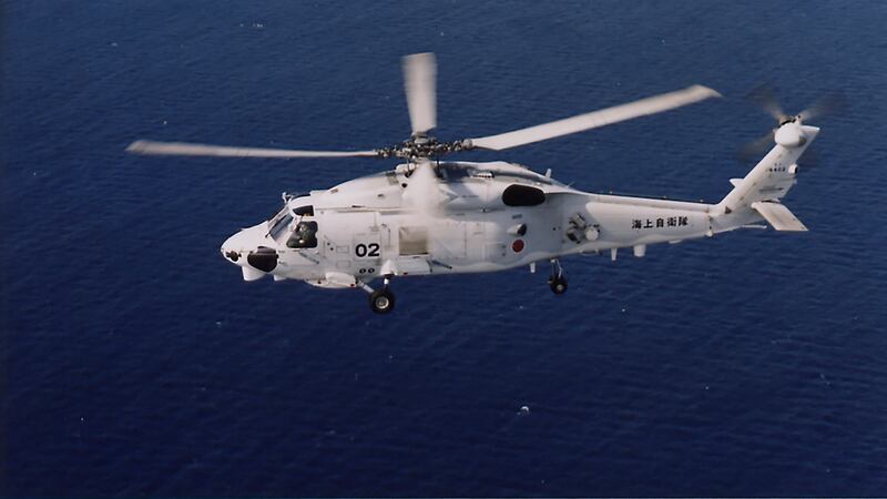 Two Japanese navy SH-60K helicopters crashed in the Pacific Ocean south of Tokyo during a night-time training flight after possibly colliding with each other, the country’s defence minister said (Japan Maritime Self-Defence Force/AP)