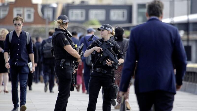 Armed police officers patrol on London Bridge in London yesterday, June 7 2017. London officials said a large part of the outer cordon of the crime scene had reopened. Borough Market, a popular gathering place, remains closed as more evidence is gathered. Theresa May was accused yesterday of doing a U-turn on security powers following the recent terror attacks<br />PICTURE: Markus Schreiber/AP