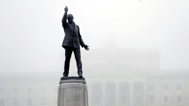 Parliament Buildings, Stormont, with Lord Carson&#39;s statue in the foreground, is blanketed in fog. (Peter Morrison/PA). 