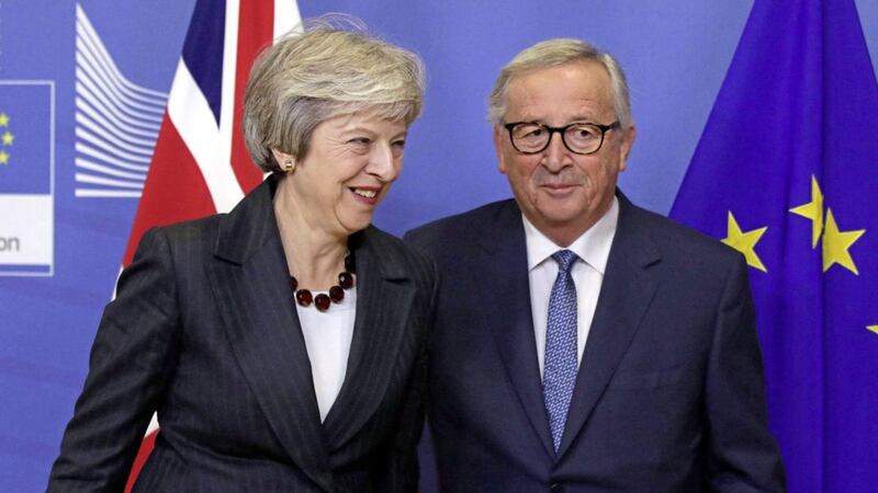 European Commission President Jean-Claude Juncker, right, greets British Prime Minister Theresa May on arrival at EU headquarters in Brussels. Picture by AP Photo/Olivier Matthys 