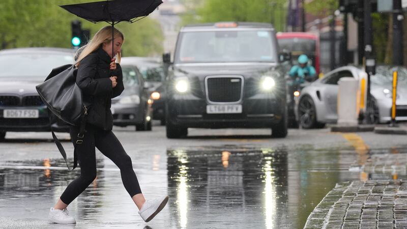 Poor weather held consumer spending back last month, as fewer people hit the high street