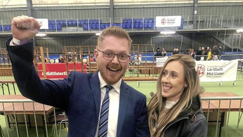 Kyle Black, son of murdered prison officer David Black, celebrates with his partner Adele Bradley after winning a council seat in Mid Ulster 