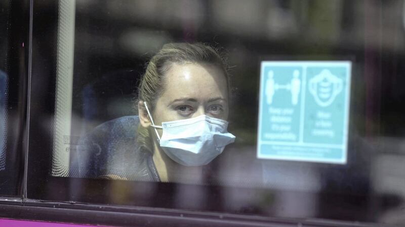 Wearing of face masks on all public transport is law in the north. Picture by Hugh Russell