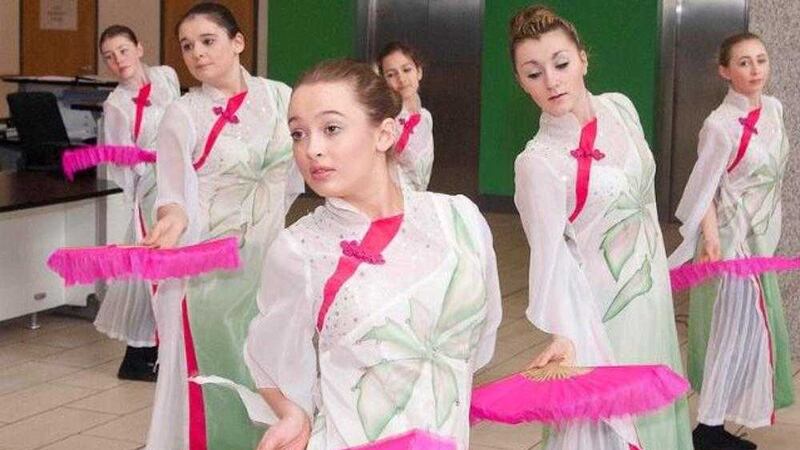 Dancers from Aquinas Grammar School perform at the opening of the Confucius Institute 