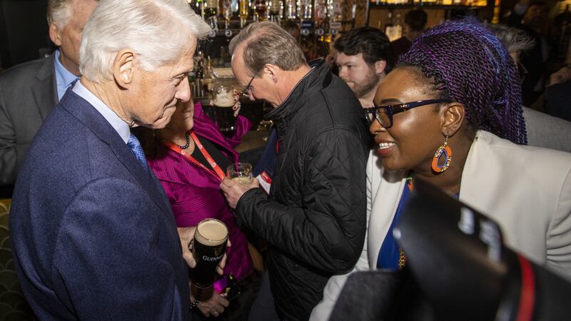 Former US President Bill Clinton speaking with Derry and Strabane District Councillor Lilian Seenoi-Barr in the Guildhall Taphouse