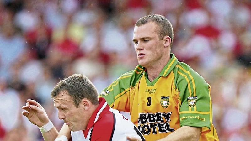 Derry star Paddy Bradley comes under pressure from Donegal&#39;s Neil McGee 