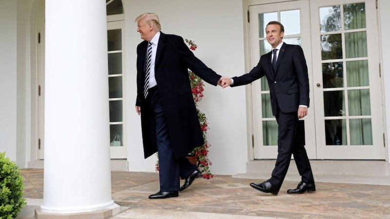 US president Donald Trump and French president Emmanuel Macron walk to the Oval Office of the White House in Washington, on Tuesday. Picture by Pablo Martinez Monsivais/AP 