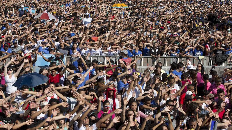 Christians raise their hands while singing Gospel songs during the annual March for Jesus in Sao Paulo, Brazil earlier this month. Tens of thousands evangelical Christians are taking part in Brazil&#39;s &#39;March for Jesus&#39;, an annual event that unites faithful from hundreds of Protestant churches in the world&#39;s largest Catholic country 