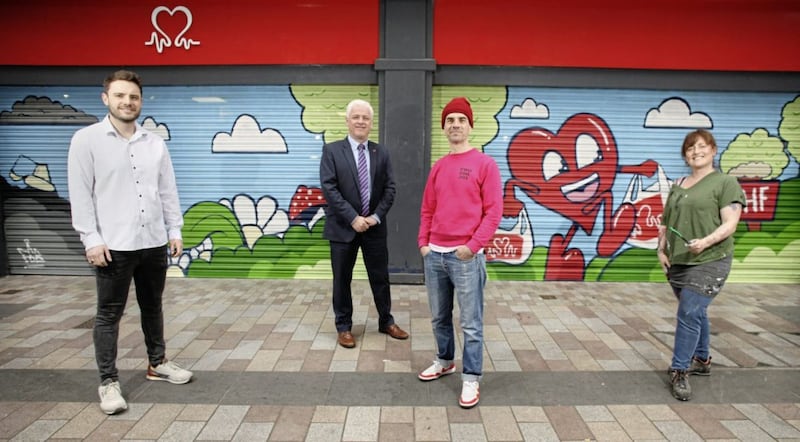 BHF Belfast shop manager Adam Mairs, left, Fearghal McKinney of BNFNI with multimedia artist Carla Hodgson and visual artist Ray Bonner at the store on Fountain Street 