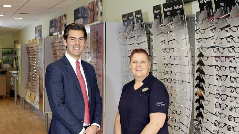 Ryan Kee of Lambert Smith Hampton with Leigh Nelson, store director at Specsavers Newtownards, which has relocated following a &pound;400,000 investment 