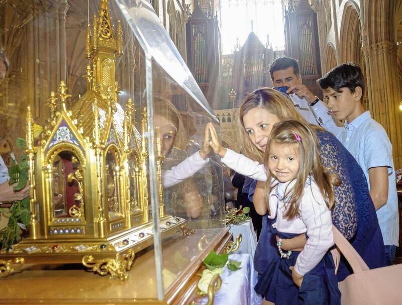 Maria Costa and her mother Christina at the relics of Saints Louis and Z&eacute;lie Martin and their daughter St Th&eacute;r&egrave;se of Lisieux in St Patrick&#39;s Cathedral, Armagh. Picture by www.LiamMcArdle.com 