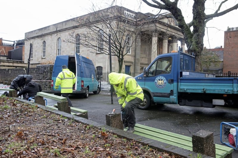 Council workers replace the slats on the benches on Thursday morning. Picture by Mal McCann 