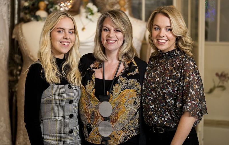 Catherine Smith with her twin daughters Katie (left) and Hope, who were born prematurely 22 years ago at just 29 weeks. Mrs Smith is using her wedding dress business to raise funds to support other families coping with early births&nbsp;