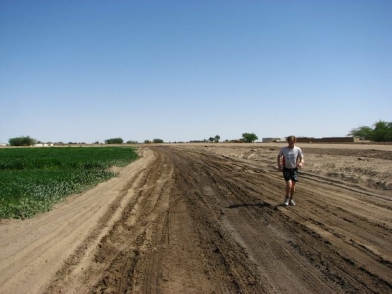 Jesper Kenn Olsen running on a rural road in Mozambique