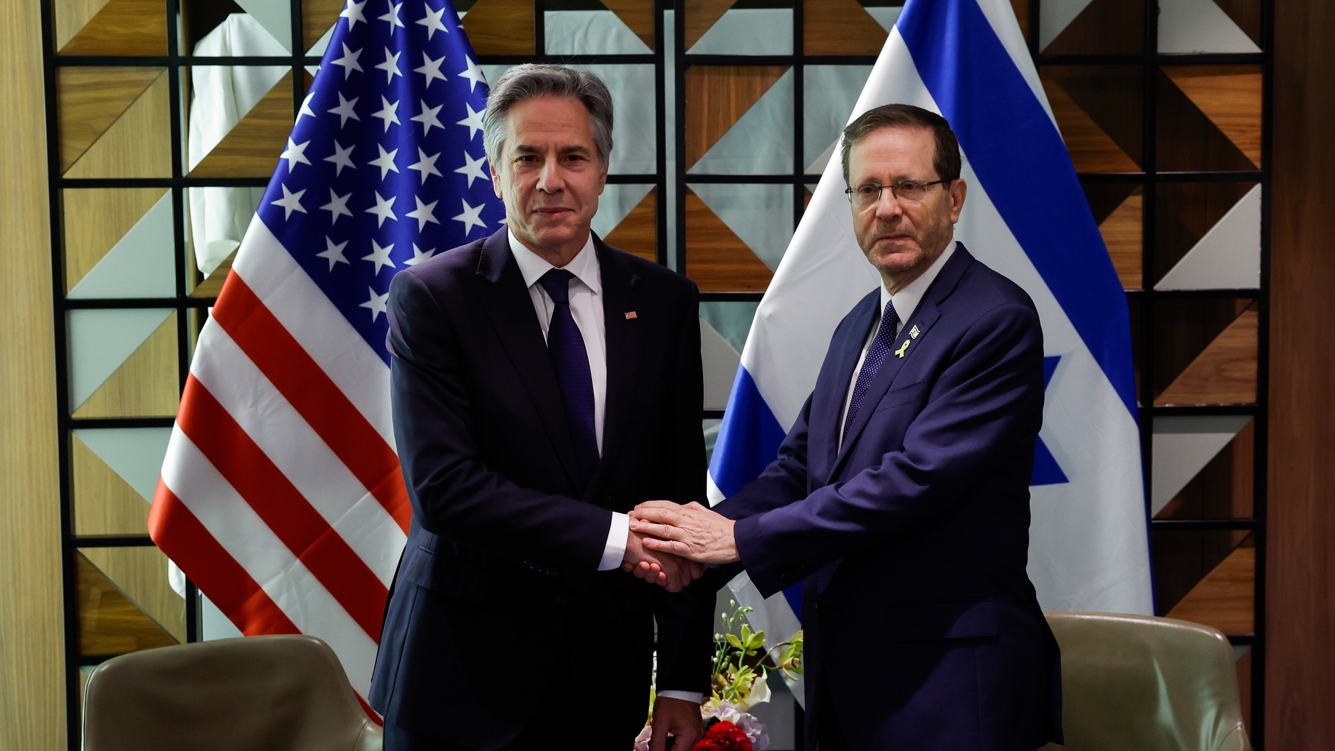 US Secretary of State Antony Blinken shakes hands with Israeli President Isaac Herzog (Evelyn Hockstein/Pool/AP)