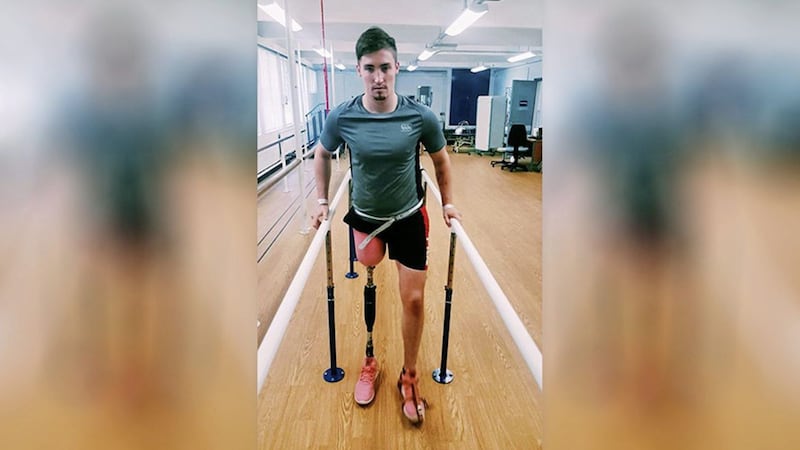 Ross Davidson pictured at Musgrave Park Hospital in Belfast where he took his first steps since having his right leg amputated following a scooter crash in Thailand 