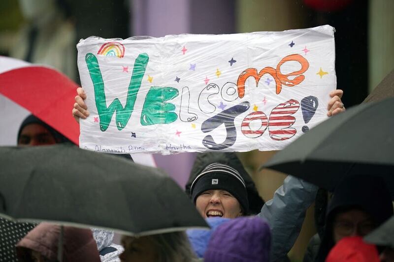 People welcome the arrival of US President Joe Biden in Dundalk in April (Niall Carson/PA)