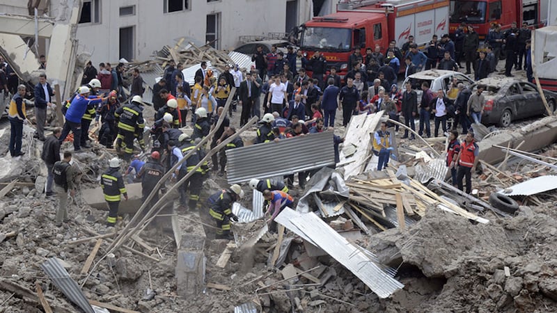 Firefighters and rescue workers work at the site after an explosion which killed one man and injured a number of other people in Diyarbakir, Turkey&nbsp;