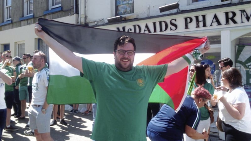 Gregory Phair, a Fermanagh fan from Newtownbutler, displaying his Palestinian flag ahead of the game in Clones 