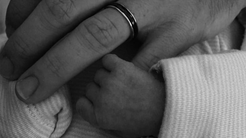 Rory McIlroy posted a photo on Instagram of baby Poppy holding his finger&nbsp;