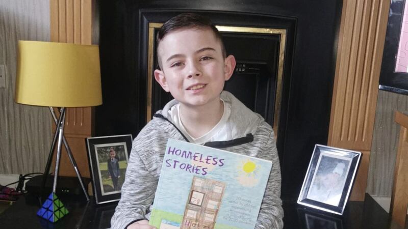 Dylan Whelan (10) from Belfast, pictured with a copy of Homeless Stories 