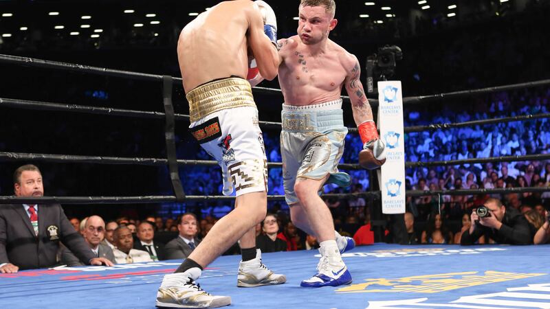 Carl Frampton goes on the offensive against Leo Santa Cruz during Saturday night's WBA Super World Featherweight Championship fight at the Barclays Center in New York.&nbsp;Picture by AP&nbsp;