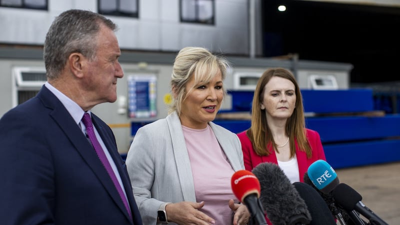 Sinn F&eacute;in's Michelle O'Neill speaking with media as party colleagues Caoimhe Archibald and Conor Murphy watch on after a factory visit to Dungannon based design and manufacturing company EDGE Innovate. Picture by Liam McBurney/PA Wire&nbsp;