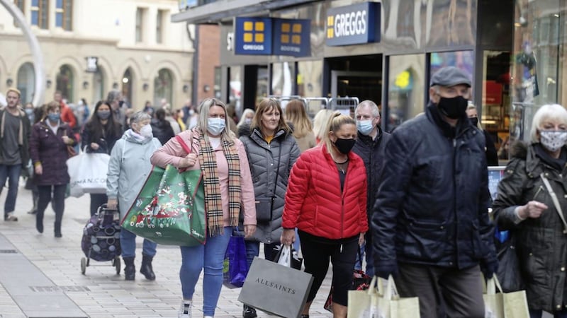 People out in Belfast to shop on the last day before lockdown. Picture by Hugh Russell. 