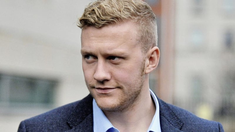 Stuart Olding leaves Belfast Crown Court after a judge was told the Crown did not intend to proceed with one of the two rape charges he faces 