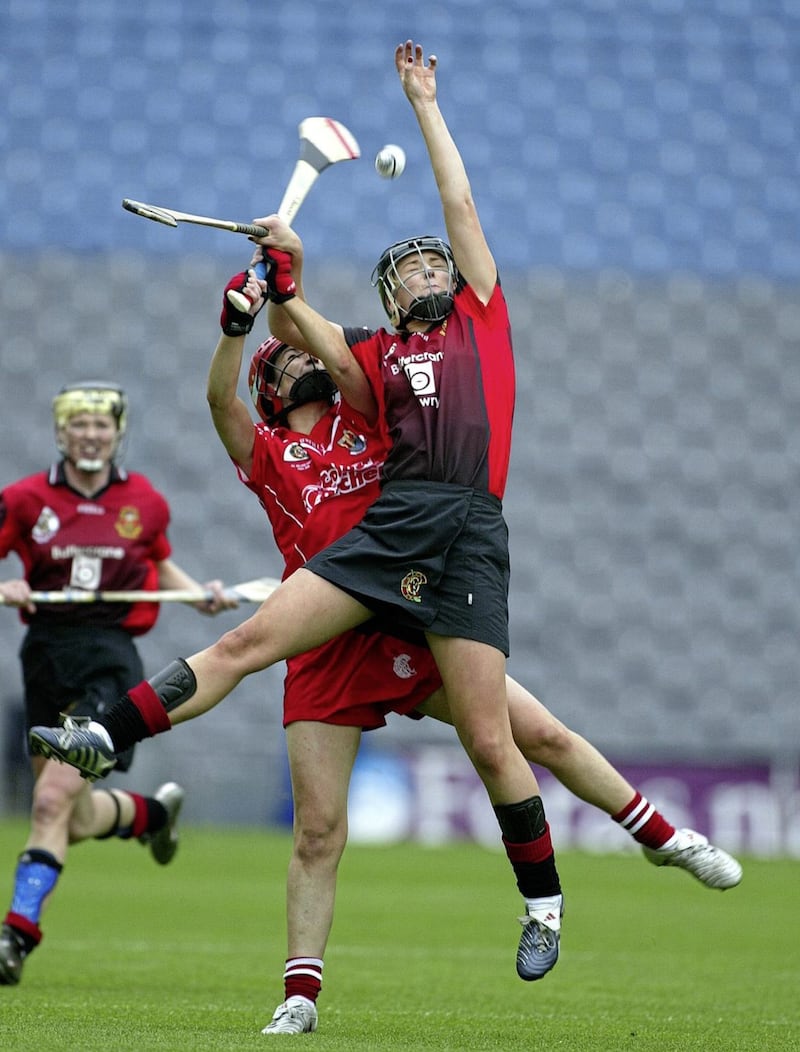 Catherine McGourty of Down and Cork&#39;s Jennifer Browne contest a high ball in the All-Ireland Junior Camogie final on September 19 2004. Picture by INPHO/Lorraine O&#39;Sullivan 