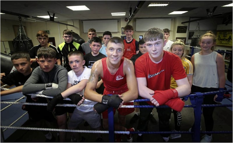 US-bound duo Lee McKee (left) and JP Hale with some of the up and coming talent at the Star boxing club in north Belfast. Picture by Hugh Russell 
