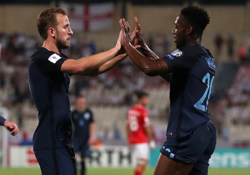 England's Harry Kane and Danny Welbeck celebrate a goal