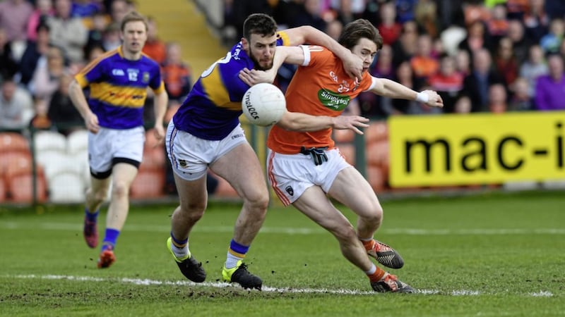 Another ball slips away from an Armagh forward, this time Andrew Murnin, up against Tipperary&#39;s Paddy Codd. 